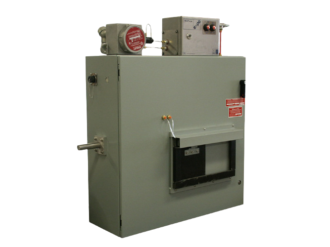 Industrial machine with control panel, red gauge, and various switches against a black background.